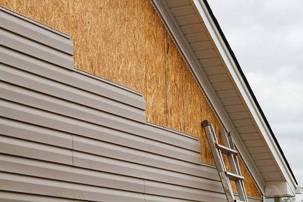 Professional Storm Damage Siding Repair technician working in Wickliffe, OH